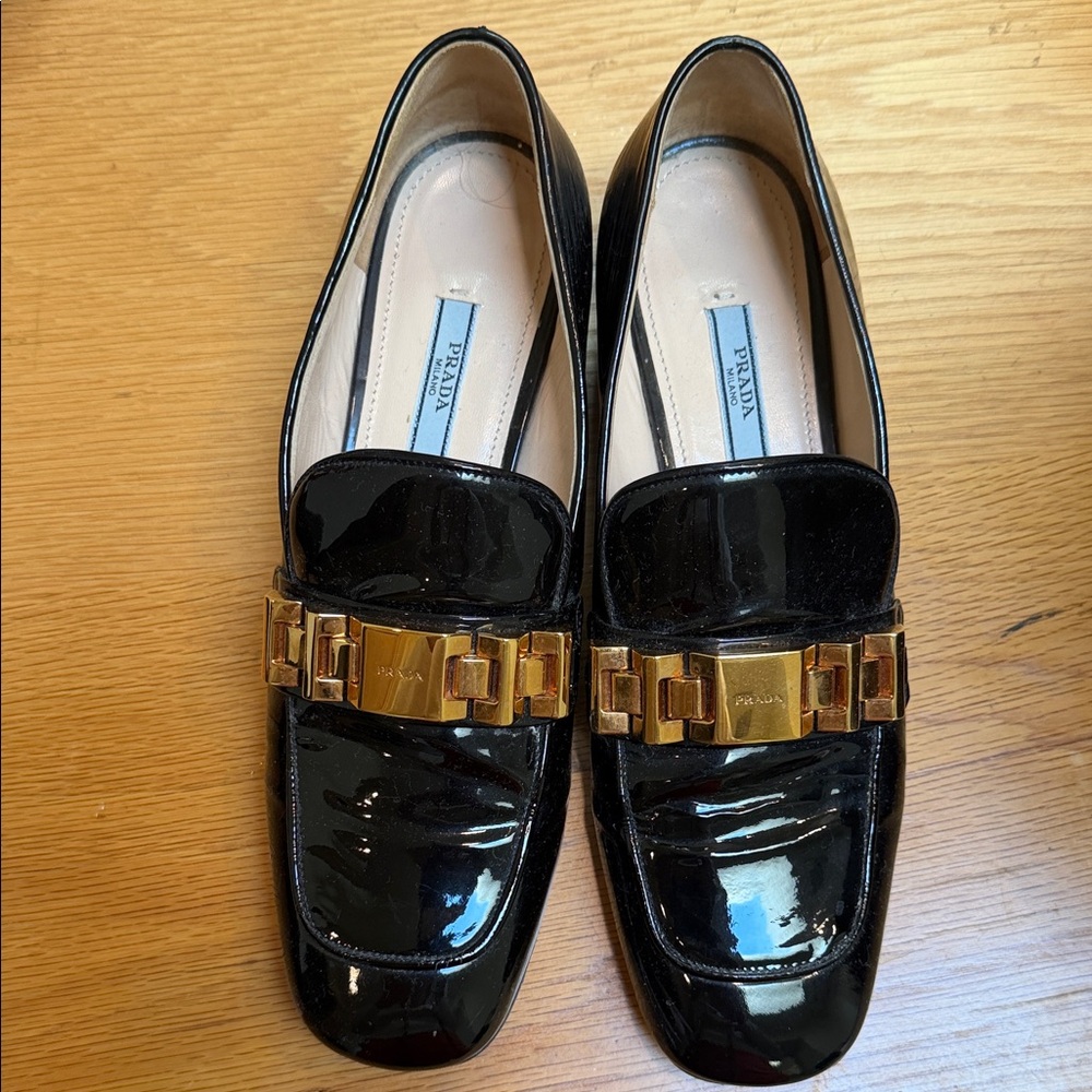 Prada Glossy Black Loafers with Gold Chain Detail